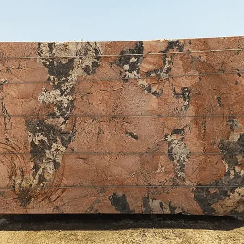 Polished Red Granite Slab with Bold Black and Cream Mineral Movement